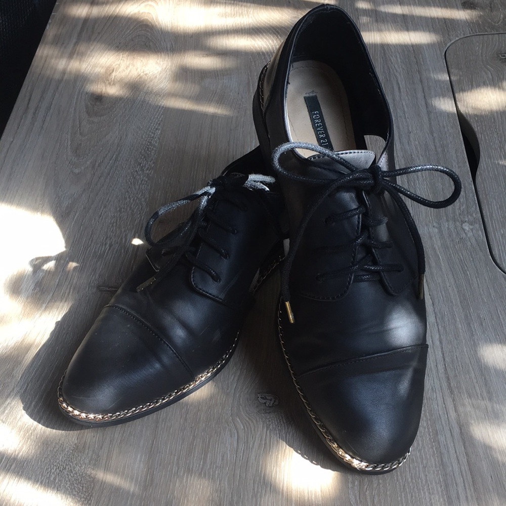 Black tie loafer with gold embellishments